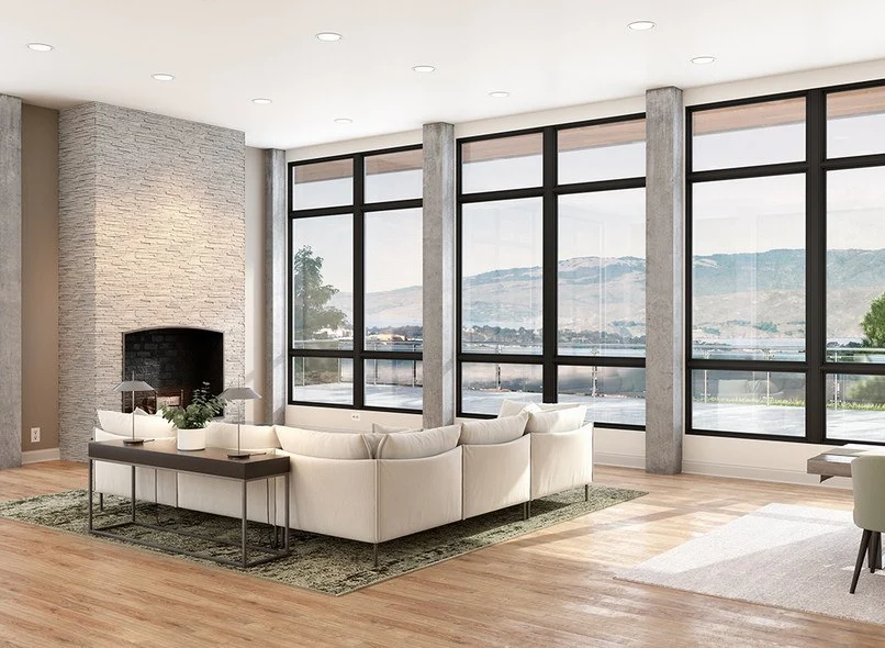 A large open living room next to a three-section wall with sections of Milgard fiberglass windows with a grid of two smaller windows, followed by two extra large windows, followed by two more small windows towards the floor.