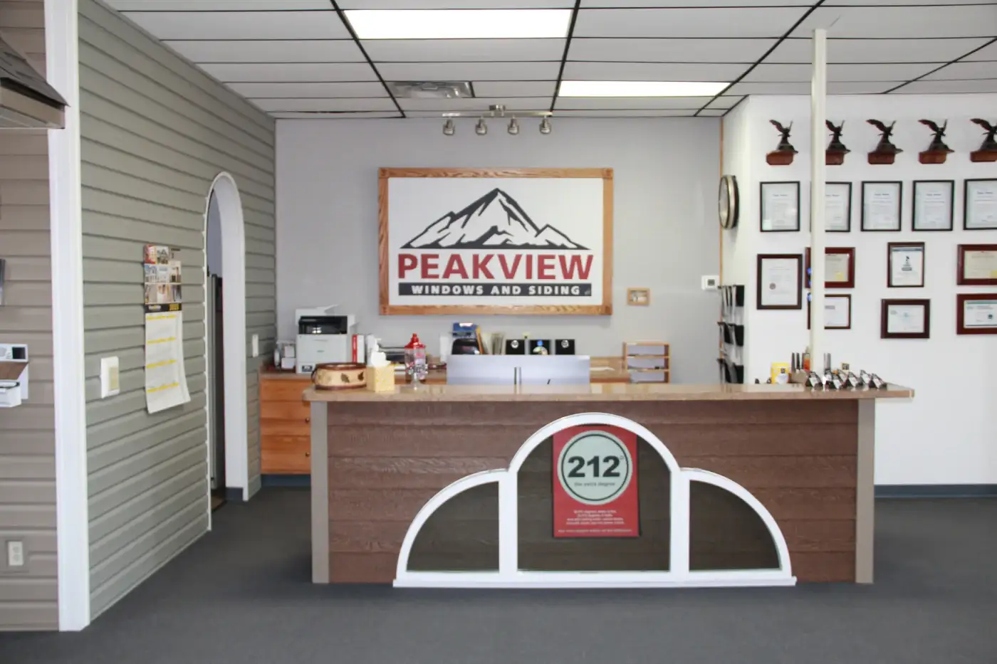 Why Choose Peakview Windows For Your Next Exterior Remodeling Project? As you walk inside the entrance to the Colorado Springs office and showroom of Peakview Windows, you see a nice reception area with a polished counter, many awards and recognitions on the wall, and the company sign on the back wall.