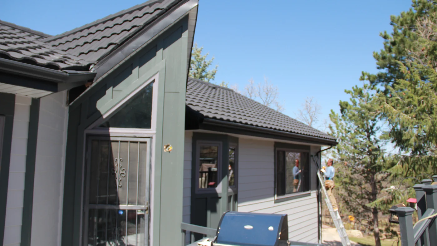 A home with white and green siding
