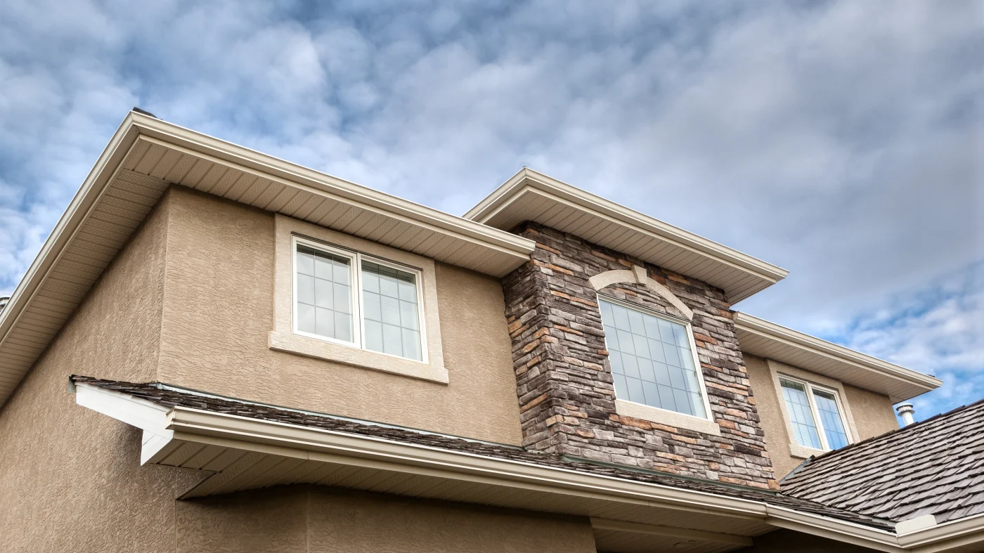 A home with tan stucco and stone accents