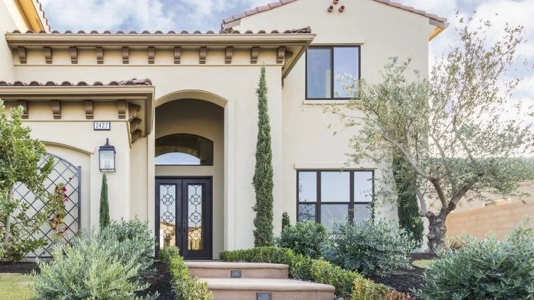 A home with tan stucco