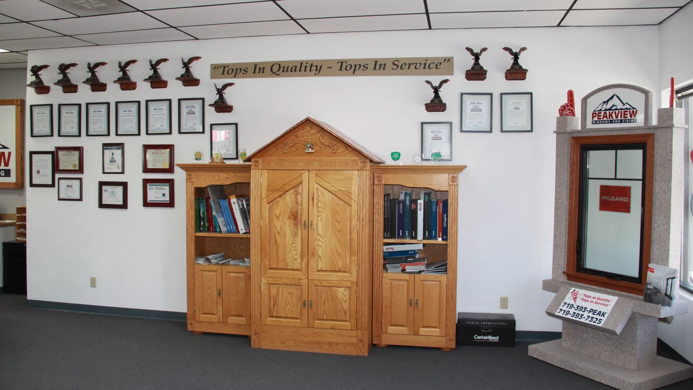 The Peakview Windows, Siding & Stucco office wall of recognition