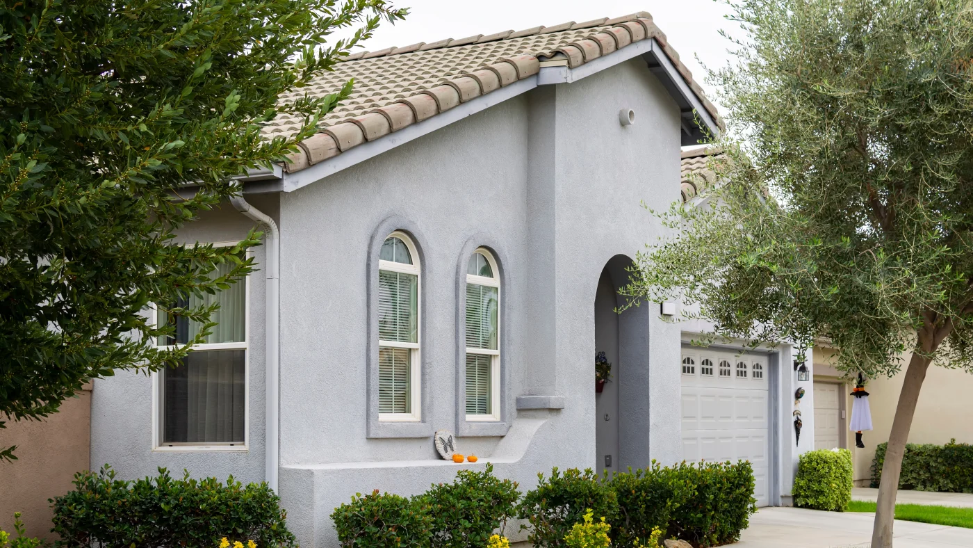 A home with a gray stucco exterior