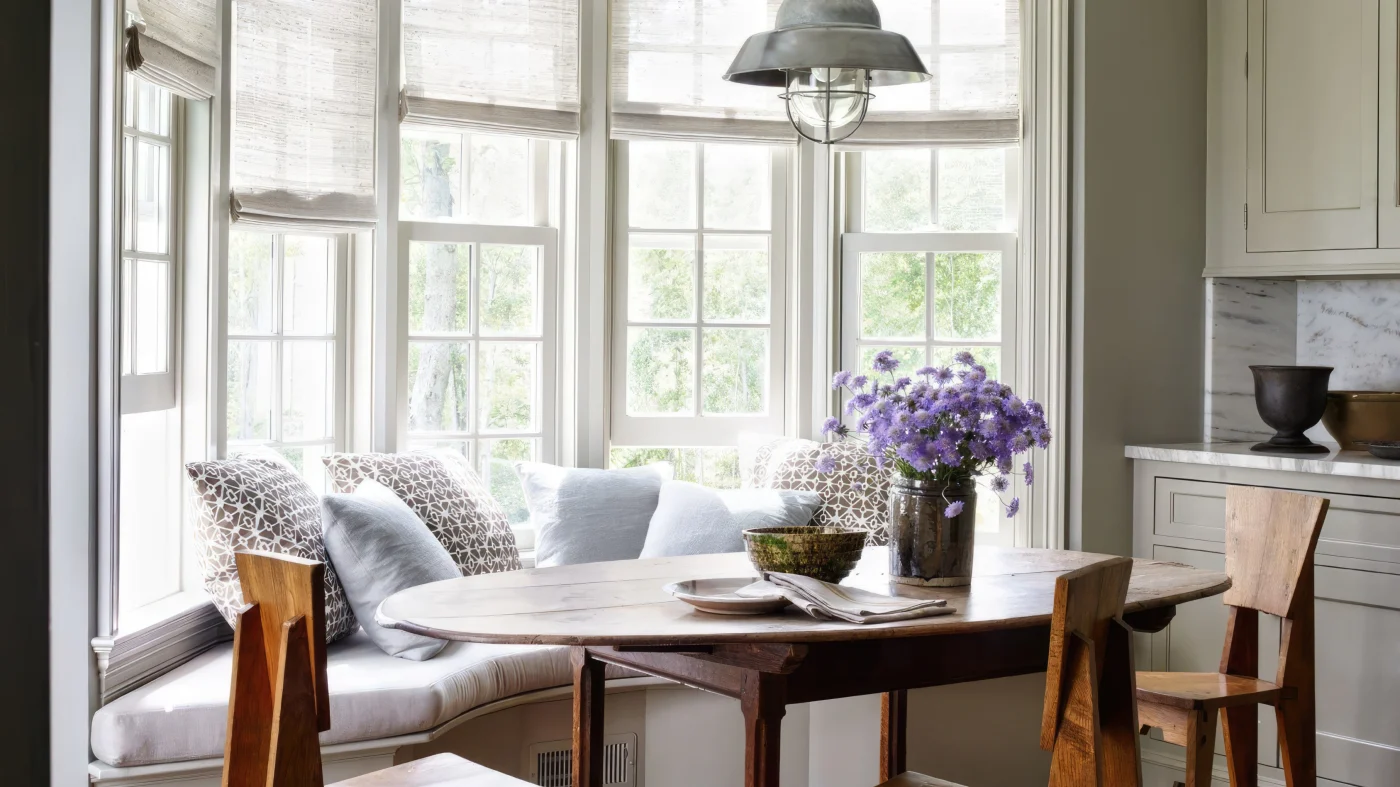 A dining area with a wall of windows