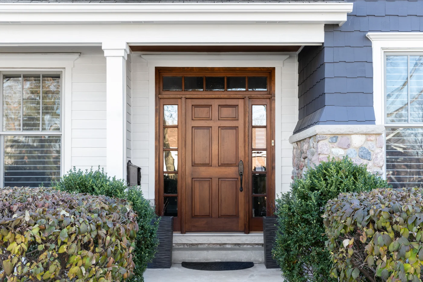 A beautiful new entry door with sidelights professionally installed on a home in Security-Widefield, Colorado by Peakview Windows technicians.