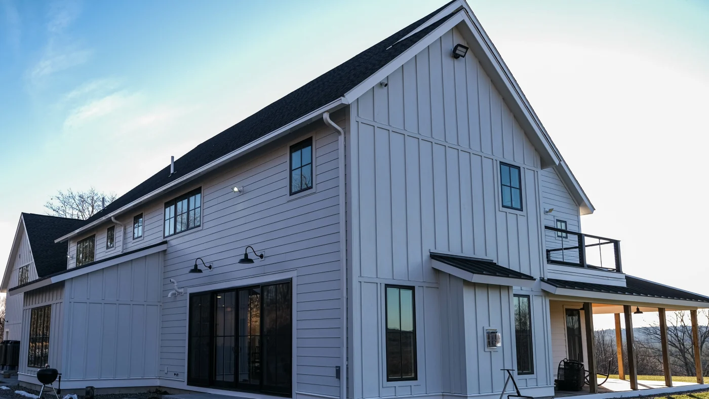 This is a residence with professionally installed gray siding that complements the modern exterior.