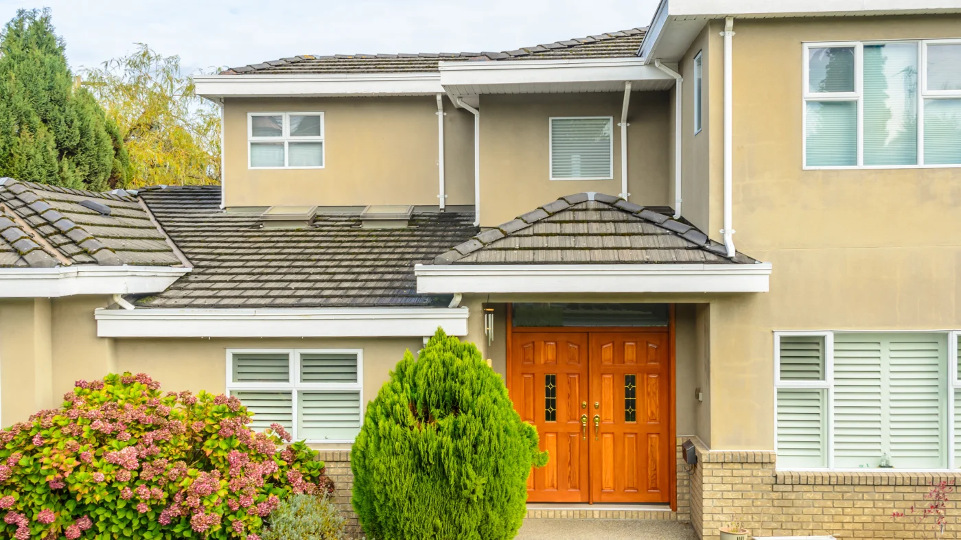A home with tan stucco and white trim