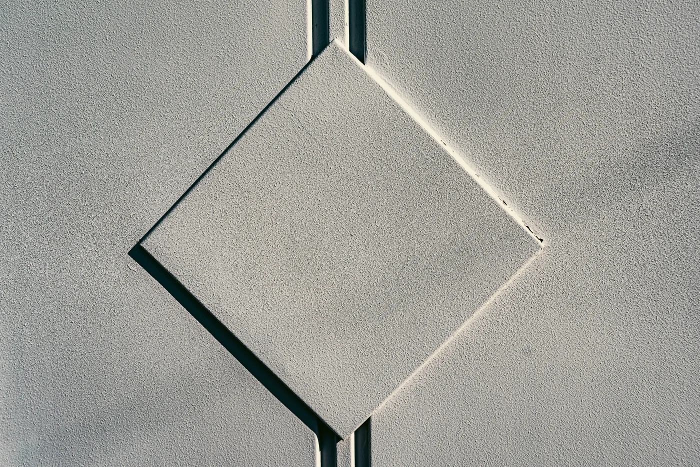 A diamond-shaped piece of stucco work.