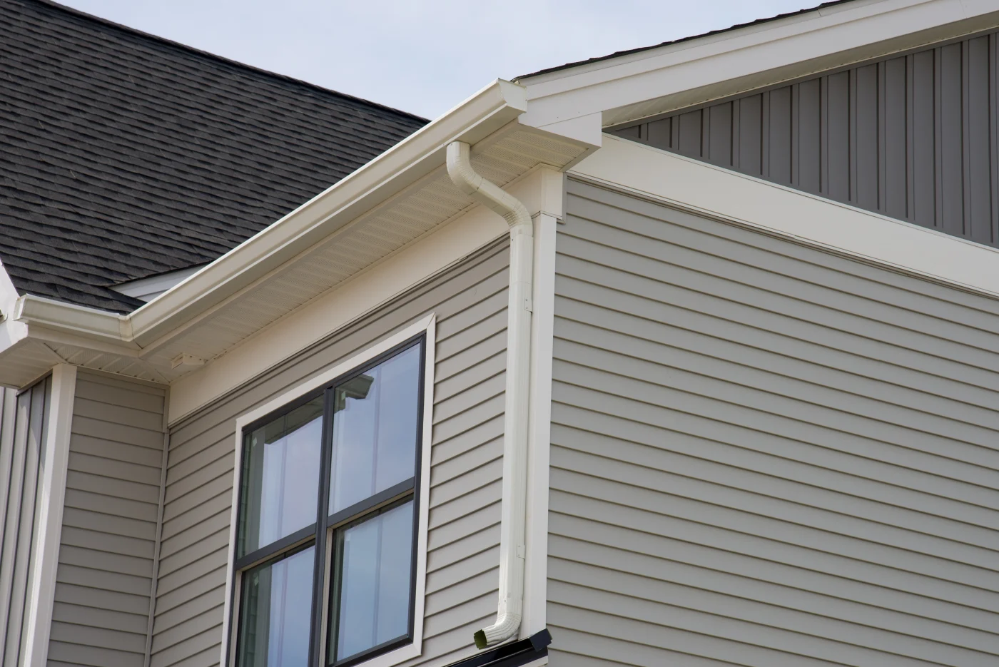 Charming suburban home with slate gray siding