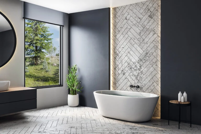 A bathroom with a picture window above a standalone tub.