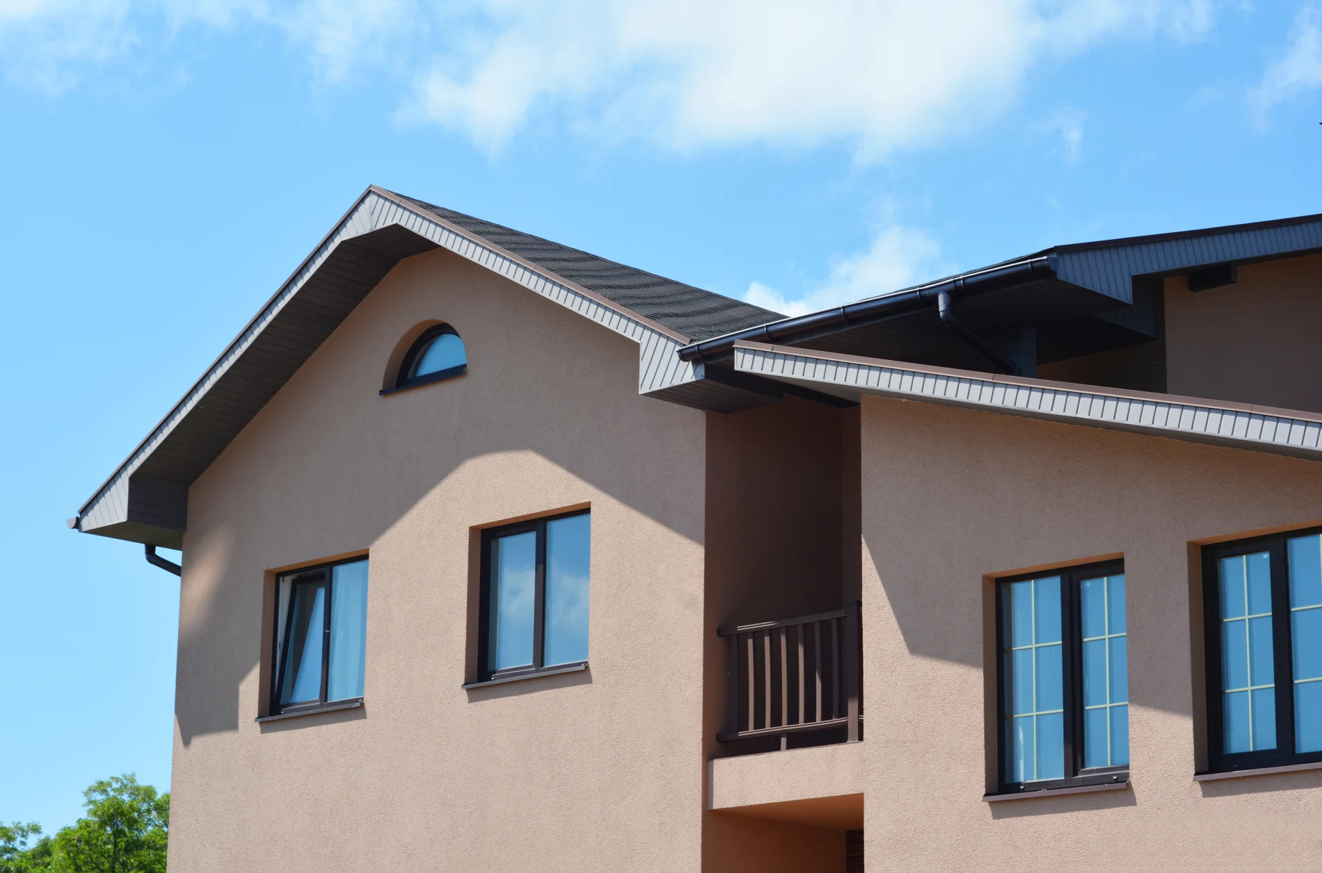 A home with a mauve stucco exterior.