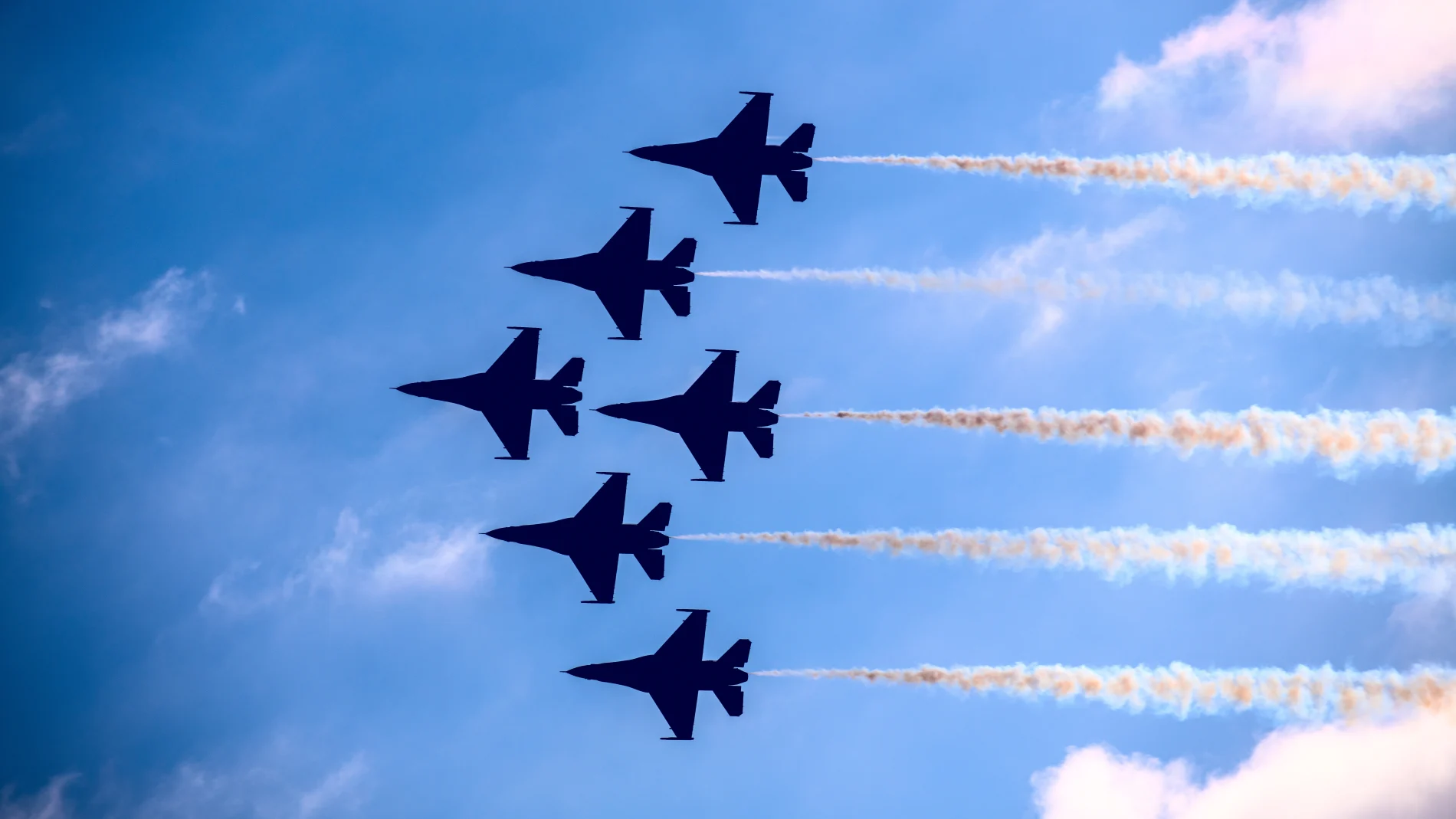 Military fighter jets fly in formation