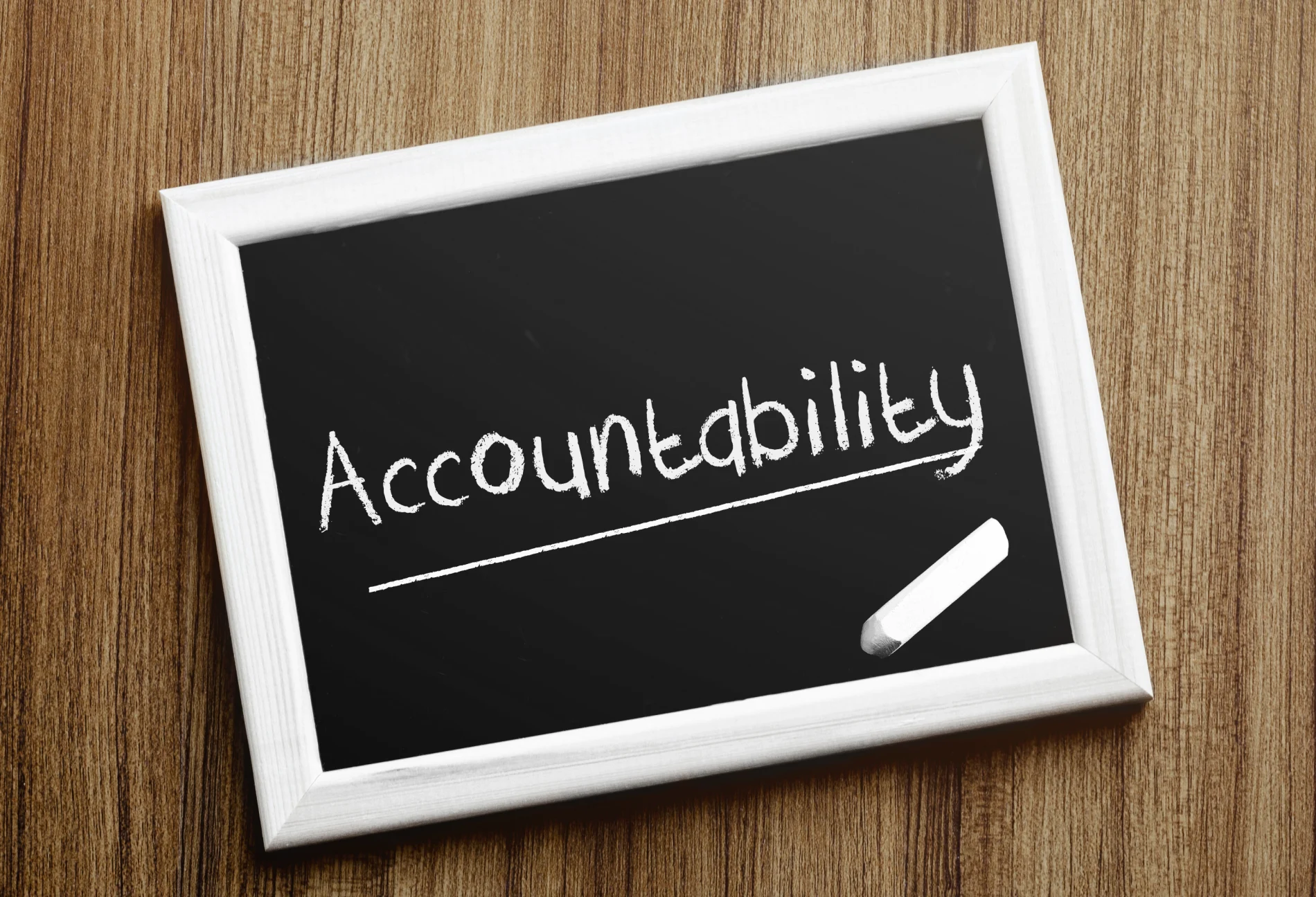 A simple chalkboard with the word “Accountability” written on it